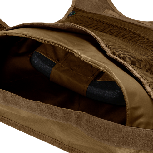 A close-up of the inside of the Condor EXO Plate Carrier Gen II reveals a black protective plate inserted into its pocket.