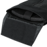 Close-up of an open black nylon pouch with a hook-and-loop fastener flap, revealing a foam pad inside.