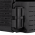 Close-up of the Condor Vanquish RS Plate Carrier in black, featuring a secured radio attached to the side with nylon straps and a cord.