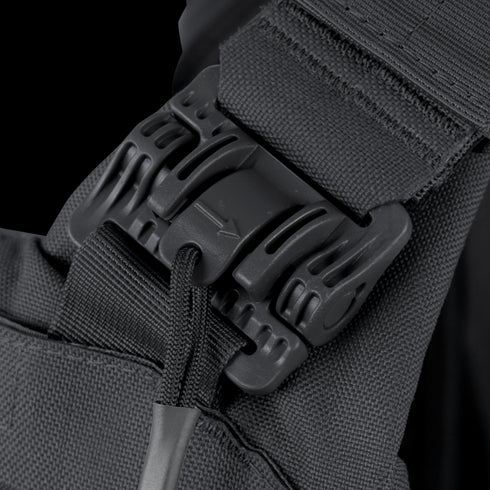Close-up of the Condor Vanquish RS Plate Carrier’s black plastic buckle fastened on a strap with rugged fabric and cord, designed for military or first responder EDC needs.