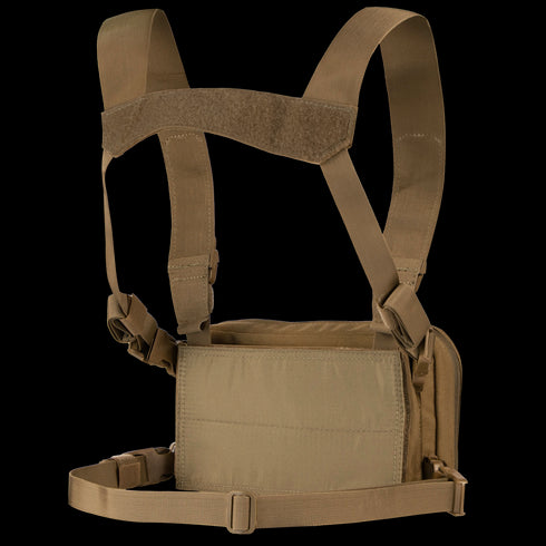 The Condor Stowaway Chest Rig is a tan military chest rig with adjustable shoulder and waist straps, and a front pouch for carrying tactical gear or supplies.
