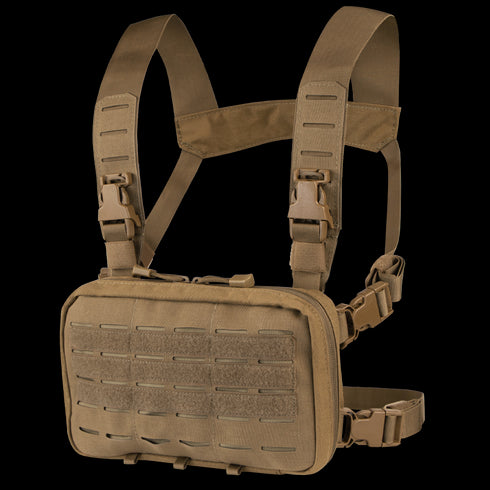 The Condor Stowaway Chest Rig is a tan tactical rig with adjustable straps, plastic buckles, a front pouch with MOLLE webbing, and hook-and-loop panels—ideal for military and first responder use.