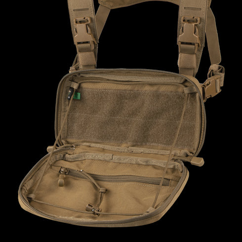 The Condor Stowaway Chest Rig in tan is open, revealing multiple zippered mesh compartments and interior straps—perfect for military or law enforcement applications.