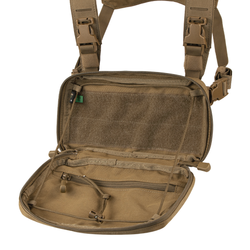 The Condor Stowaway Chest Rig in tan is open, revealing multiple zippered mesh compartments and interior straps—perfect for military or law enforcement applications.