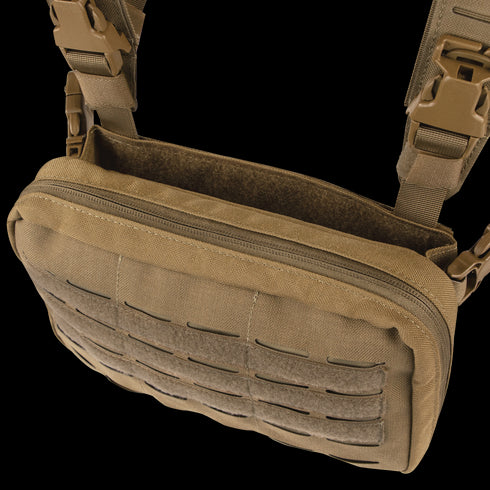 The Condor Stowaway Chest Rig is a tan tactical shoulder bag with MOLLE webbing, zippered main compartment, and adjustable straps; ideal for military or first responders. Black container shown in background.