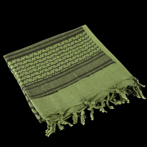 The Condor Shemagh in Olive Drab & Black features tasseled edges and a bold pattern, making it ideal as stylish headwear or a versatile protective layer.