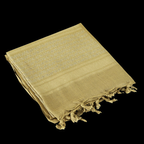 The Condor Shemagh in tan, featuring tassels at the ends, is a versatile protective scarf shown folded on a white background.