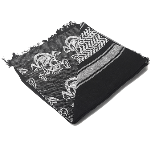 The Condor Shemagh - Skull is a folded black and white scarf with skull patterns and geometric designs, finished with frayed edges on one side.