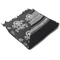 The Condor Shemagh - Skull is a folded black and white scarf with skull patterns and geometric designs, finished with frayed edges on one side.