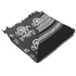 The Condor Shemagh - Skull is a folded black and white scarf with skull patterns and geometric designs, finished with frayed edges on one side.