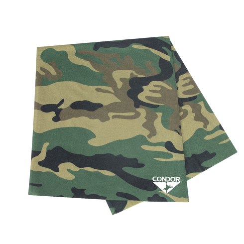 The Condor Multi Wrap in Woodland features green, brown, and black camouflage patterns with a white Condor logo on one corner. This versatile headwear is perfect for outdoor adventures and multiple uses.
