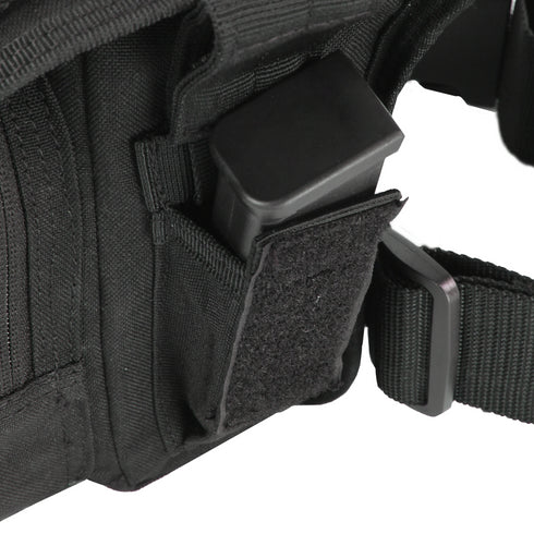 Close-up of the Condor Cross Over Leg Rig in black, used for EDC, featuring a magazine partially inserted and secured by a hook-and-loop flap, shown attached to a belt.