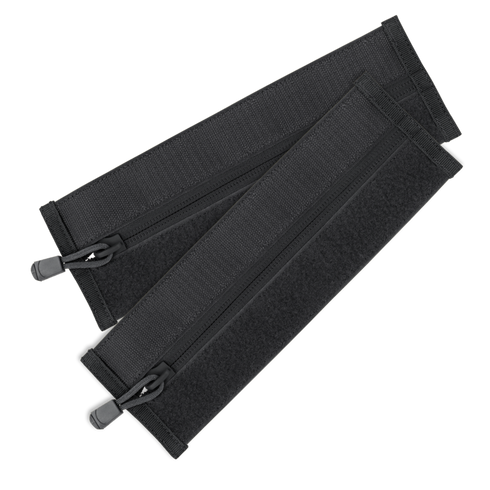 The Condor VAS Zipper Strips are two black fabric straps with zippers and hook-and-loop fasteners, arranged in a crisscross pattern—perfect for organizing bushcraft or first responder gear.