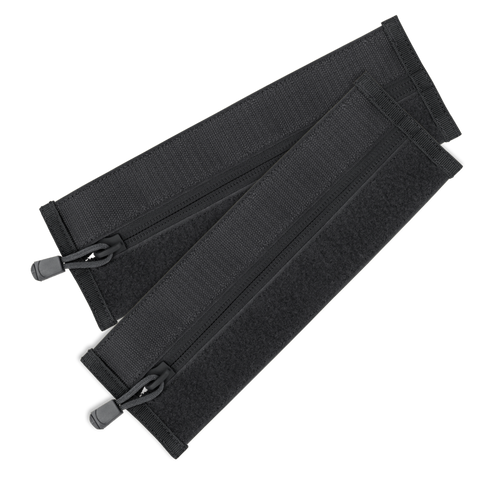The Condor VAS Zipper Strips are two black fabric straps with zippers and hook-and-loop fasteners, arranged in a crisscross pattern—perfect for organizing bushcraft or first responder gear.