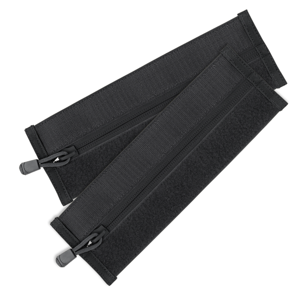 The Condor VAS Zipper Strips are two black fabric straps with zippers and hook-and-loop fasteners, arranged in a crisscross pattern—perfect for organizing bushcraft or first responder gear.