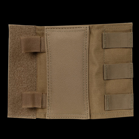 The Condor Shoulder Pad PC is a tan tactical nylon and leather pouch with hook-and-loop closures, multiple elastic straps on the right side, and added shock protection—an essential piece of tactical gear.