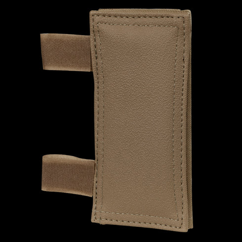 The Condor Shoulder Pad PC is a rectangular brown textured pad with two elastic loops on the left side, designed for tactical gear or shock protection.