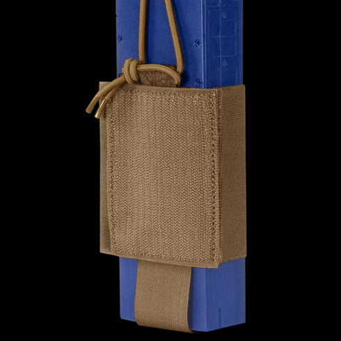 The Condor VAS Wing Pouch, made from tan tactical nylon, securely holds a blue training magazine with an adjustable cord—ideal for military or first responders.