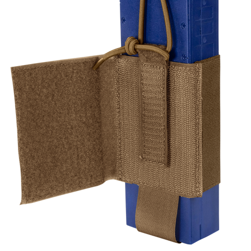 A close-up of the Condor VAS Wing Pouch in tan, designed for EDC or bushcraft, securely holds a blue rectangular object with adjustable straps and a hook-and-loop flap.