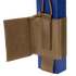 A close-up of the Condor VAS Wing Pouch in tan, designed for EDC or bushcraft, securely holds a blue rectangular object with adjustable straps and a hook-and-loop flap.