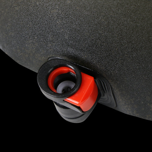Close-up of a black and red valve on the Condor Torrent Reservoir Gen II, attached to its textured black surface.