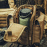 A tactical tan backpack unzipped to show a Condor Vacuum Sealed Thermal Bottle inside—perfect for bushcraft or everyday carry with its multiple compartments.