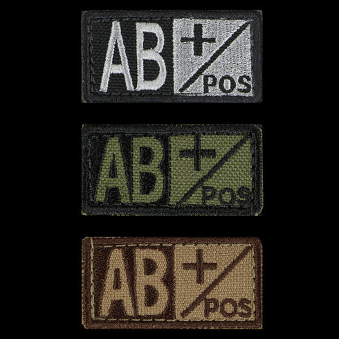 The Condor Blood Type Patch comes in three color variants—black/white, black/green, and brown/tan—clearly displaying AB+ POS for quick identification of AB positive blood type in the field.