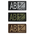 The Condor Blood Type Patch comes in three color variants—black/white, black/green, and brown/tan—clearly displaying AB+ POS for quick identification of AB positive blood type in the field.