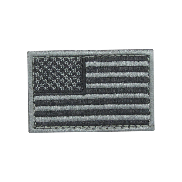 The Condor US Flag Patch features a grayscale American flag with stars in the upper left and horizontal stripes, ideal for law enforcement or shooting range enthusiasts.