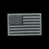 The Condor US Flag Patch features a grayscale American flag with stars in the upper left and horizontal stripes, ideal for law enforcement or shooting range enthusiasts.