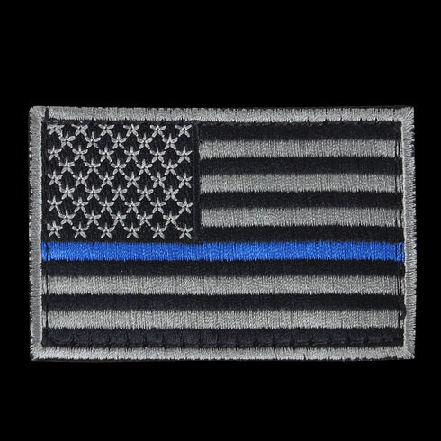 The Condor US Flag Patch features a black and white American flag with a single blue stripe across the center, honoring First Responder service and dedication.