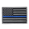 The Condor US Flag Patch features a black and white American flag with a single blue stripe across the center, honoring First Responder service and dedication.