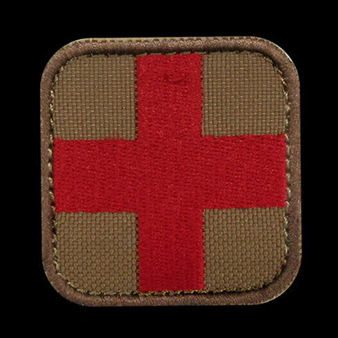 The Condor Medic Patch is a fabric EDC patch with a red cross centered on a brown rounded square—perfect for law enforcement or first responder identification.