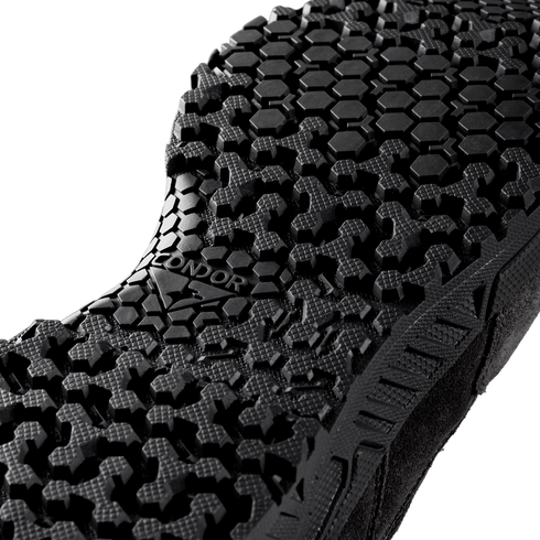Close-up of the black sole on the Condor Brigade 8" Tactical Boots - Zip, featuring a textured hexagonal and cross-shaped tread pattern. The word "CONDOR" appears in raised letters at the center.