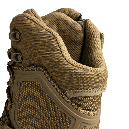 Close-up of the upper section of Condor Brigade 8" Tactical Boots - Zip (Coyote Brown), displaying textured fabric, laces, metal eyelets, and reinforced stitching.