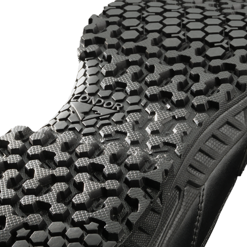Close-up view of the black Brigade 8" Tactical Boots - Zip by Condor, showing a textured sole with a hexagonal tread pattern and "CONDOR" embossed in the center.