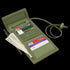 The Condor Vault Tri-Fold Wallet is an open green tactical fabric wallet, featuring separate compartments for cash, credit cards, and a pen, plus a cord with a plastic toggle.