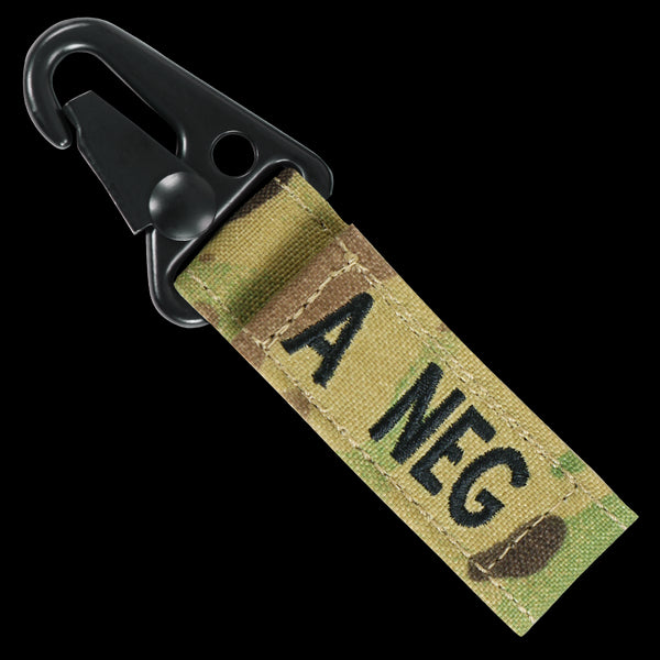 The Condor Blood Type Key Chain Scorpion OCP features a camouflage fabric strap and metal carabiner, labeled A NEG—perfect for EDC or law enforcement pros needing quick key access.
