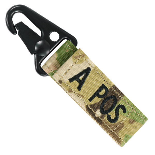 The Condor Blood Type Key Chain Scorpion OCP is a camouflage fabric keychain with a black metal clip, labeled A POS in black, perfect for bushcraft enthusiasts or first responders needing quick blood type info.
