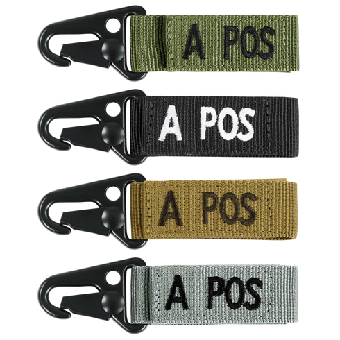 The Condor Blood Type Key Chain set includes four keychains with black metal clips and fabric straps in green, black, brown, and gray, each featuring “A POS” embroidered text.