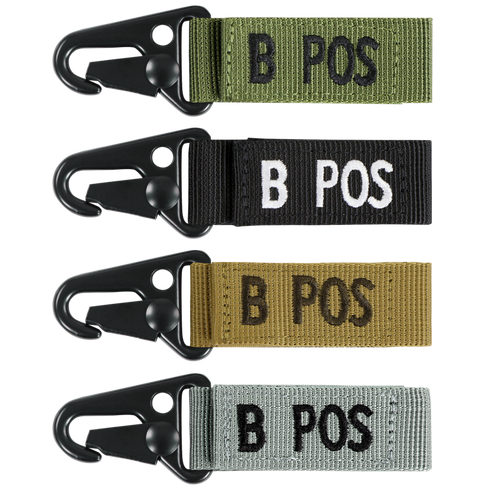 The Condor Blood Type Key Chain set features four keychains with plastic clips and fabric tags labeled B POS, available in green, black, tan, and gray.