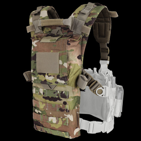 The Condor Hydro Harness Integration Kit in Scorpion OCP features adjustable straps, multiple pouches, and a mesh inner lining. The camouflage-patterned harness is displayed on a white background.
