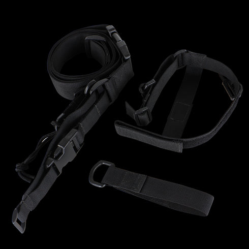 The Condor 3-Point Sling, a black adjustable nylon strap with plastic buckles and metal rings, is ideal for bushcraft or first responder use and is shown laid out on a white background.