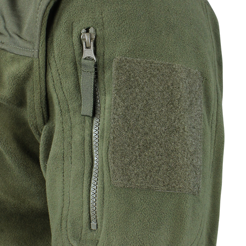 Close-up of the Alpha Fleece Jacket by Condor, featuring a green sleeve with a zippered pocket, pull tab, and rectangular loop fabric patch for attaching patches.
