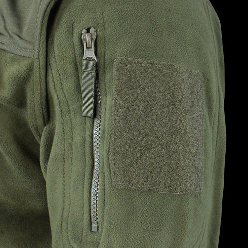 Close-up of the Alpha Fleece Jacket by Condor, featuring a green sleeve with a zippered pocket, pull tab, and rectangular loop fabric patch for attaching patches.