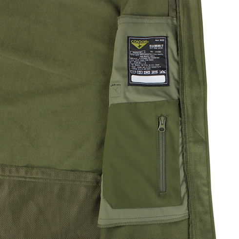 Close-up of the olive green Summit Softshell Jacket by Condor, featuring a tactical hood, zippered pocket, and a label with washing instructions and Condor branding.