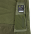 Close-up of the olive green Summit Softshell Jacket by Condor, featuring a tactical hood, zippered pocket, and a label with washing instructions and Condor branding.