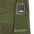 Close-up of the olive green Summit Softshell Jacket by Condor, featuring a tactical hood, zippered pocket, and a label with washing instructions and Condor branding.