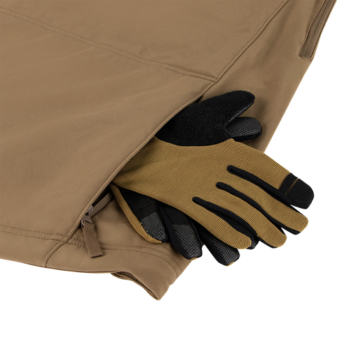 A pair of brown and black work gloves with thermal insulation are partially tucked into the zippered pocket of a tan Condor Summit Softshell Jacket.