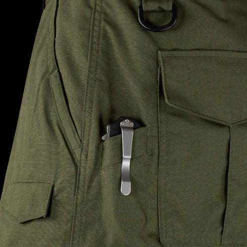 A folding pocket knife clipped to the outer pocket of Condor Sentinel Tactical Pants.